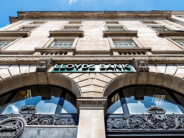 Lloyds Bank branch within an historic sandstone building, pictured from below 